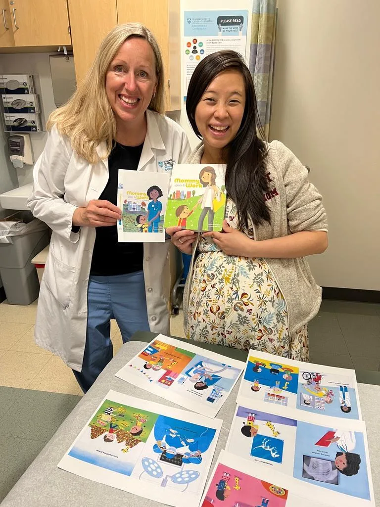 Jossy Lee and Jenny, her delivery room nurse, holding the Hospital edition over its printed spreads