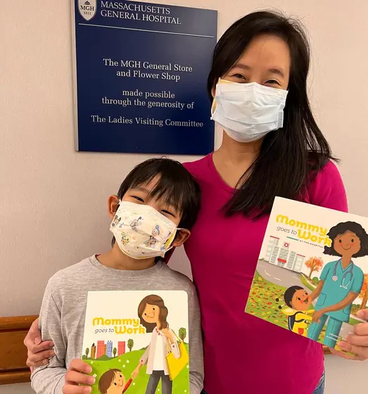 Jossy Lee and her son with the books at the MGH General Store and Flower Shop
