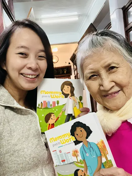 Jossy Lee and her grandmother holding the Hospital edition