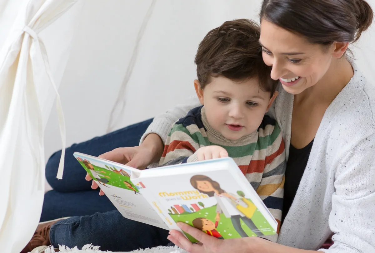 A mother and son reading together