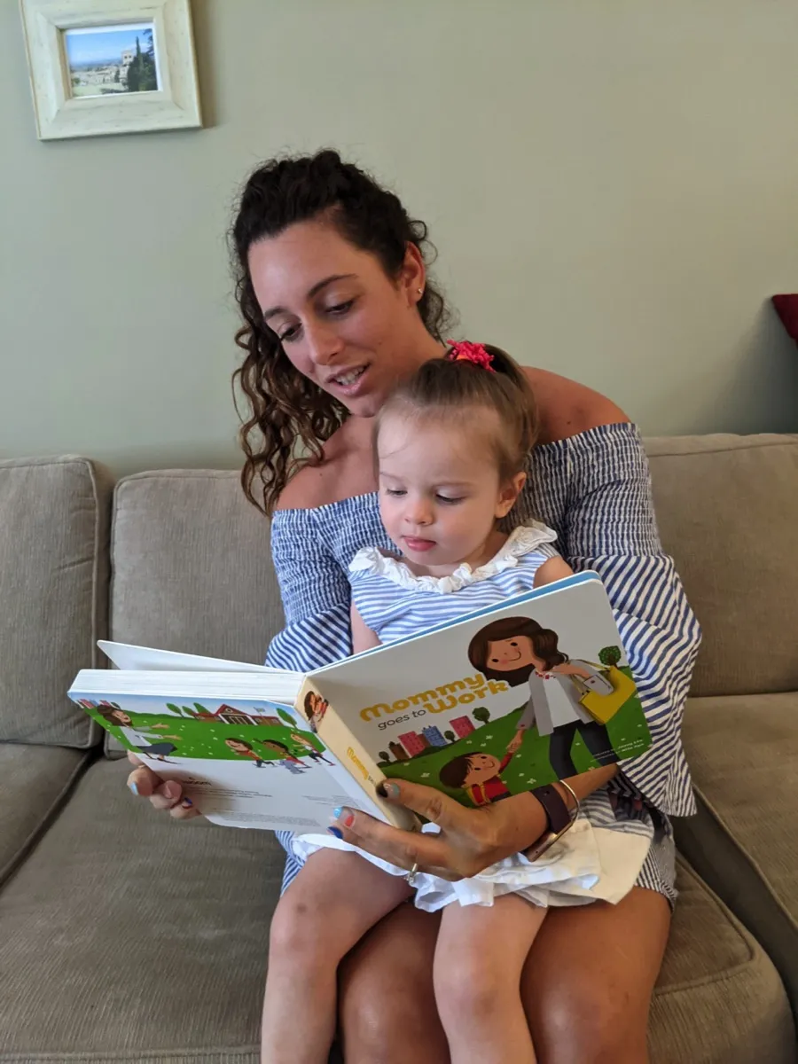 A mother reading to her toddler
