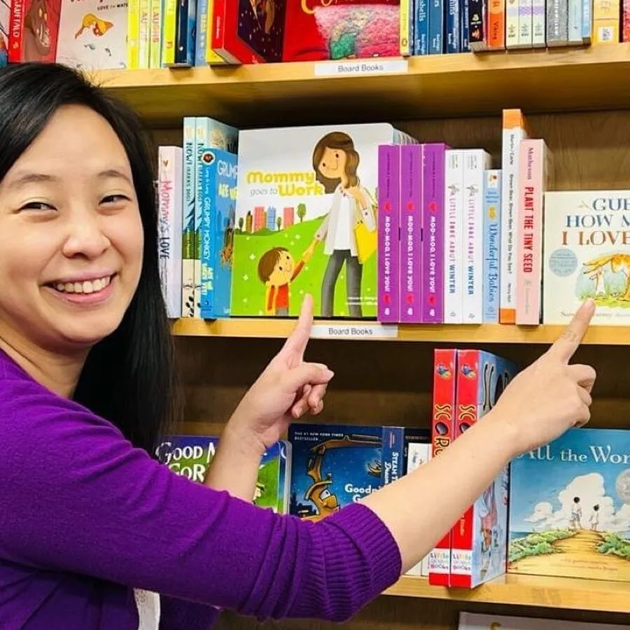 The book on a bookshop shelf, between Corduroy and Guess How Much I Love You